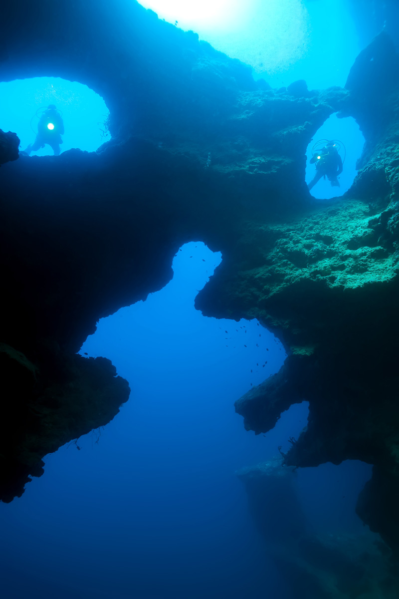 Moalboal, Cebu, Philippines - Divers in the cathedral in Pescador Island