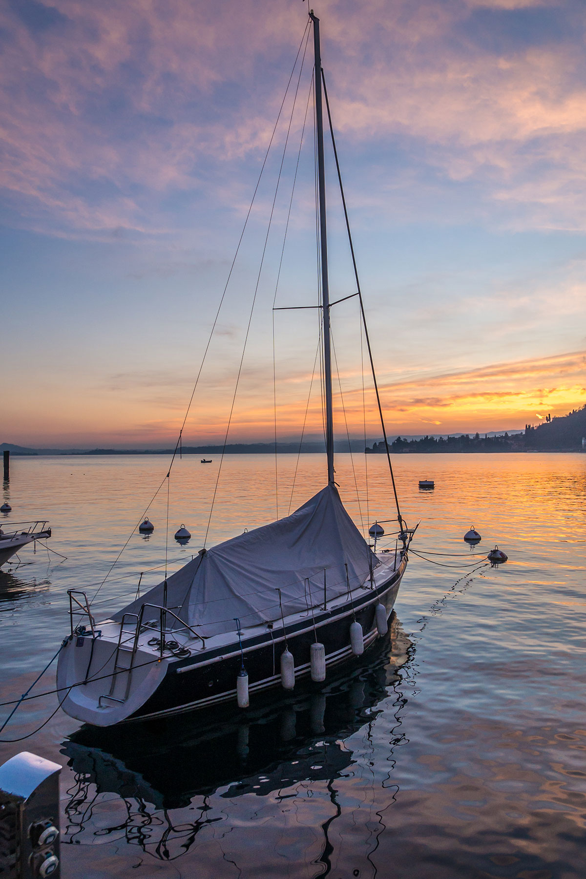 Sailboat at the dock of Toscolano , Lake Garda